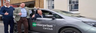 Councillors and Mayor standing in front of an enterprise EV