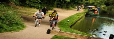 People cycling along a canal