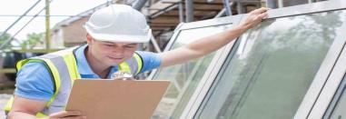 Builder installing double glazed windows.