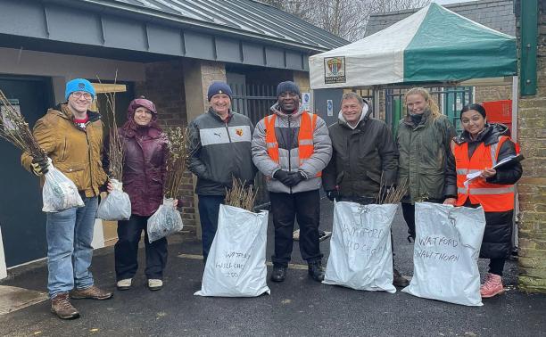 Watford residents brave the weather to collect free trees